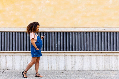 pregnant walking on phone