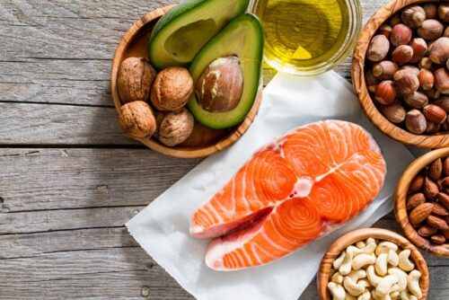 Fish, nuts, and seeds to represent foods in a diet that contain omega 3 and 6.
