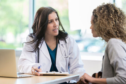 A doctor talking to patient.
