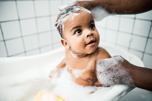 toddler in bath