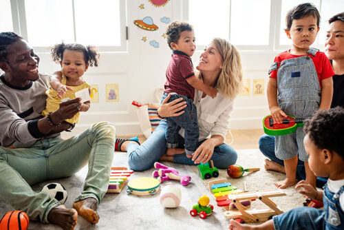 group of parents playing with children