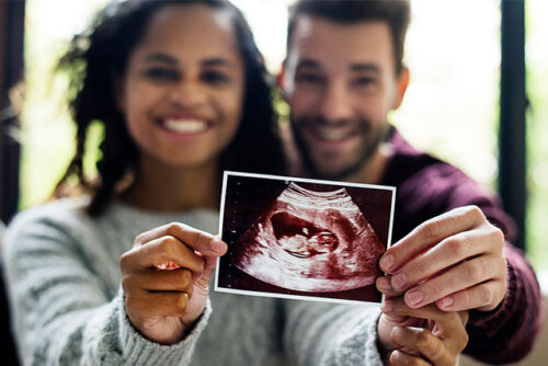 couple holding sonogram