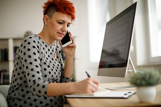 pregnant woman working at computer