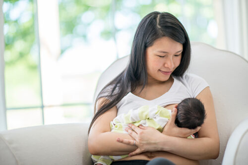 Mother breastfeeding baby