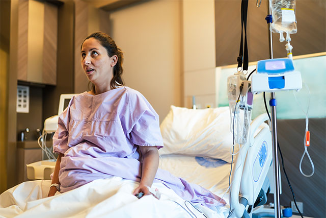 pregnant woman in hospital bed