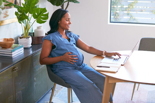 pregnant woman at computer