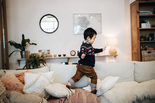 toddler running on couch