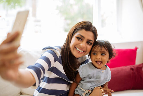 mom taking selfie with baby