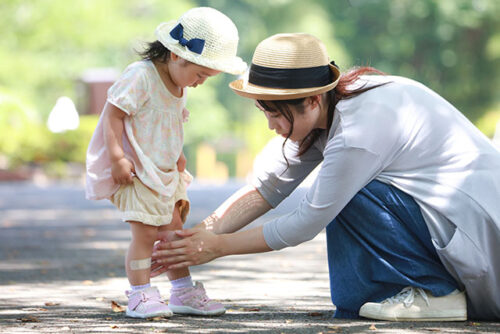 mom checking toddlers injury