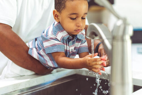 toddler washing hands