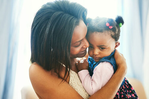 mom holding toddler