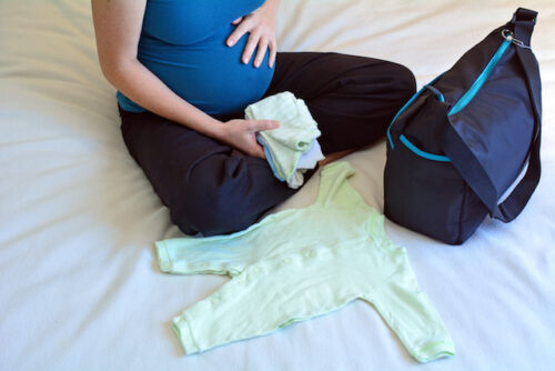 pregnant woman packing her hospital bag