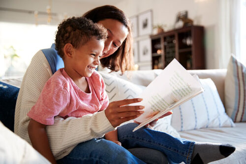 mom and toddler reading