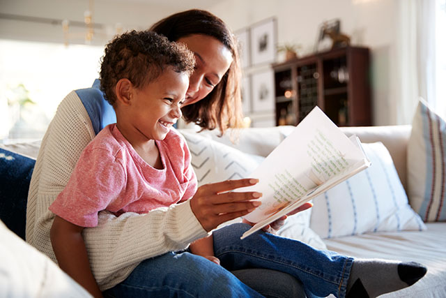 mom and toddler reading