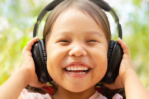 toddler with headphones