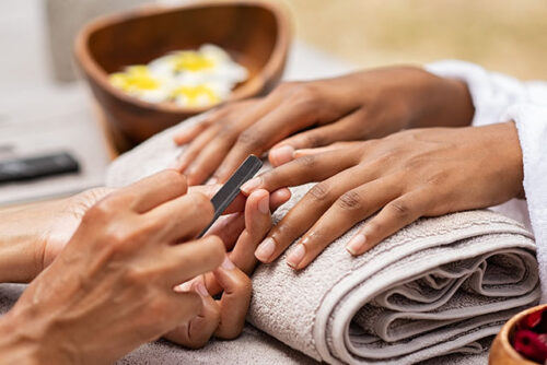 woman getting nails done