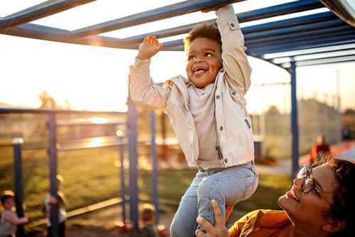 toddler on monkey bars