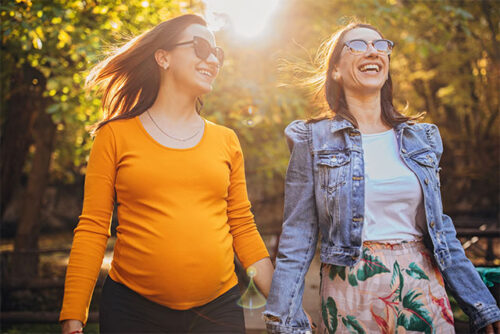 expecting couple walking