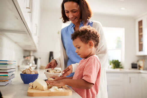 mom and toddler cooking