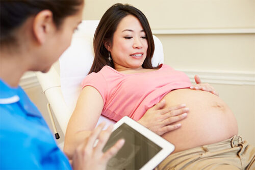 pregnant woman with doctor