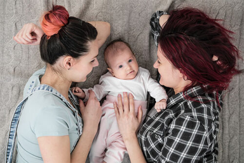 couple on the floor with newborn