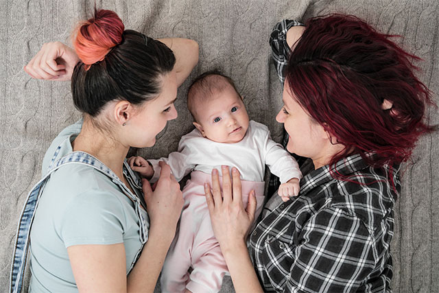 couple on the floor with newborn