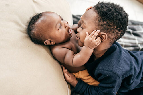toddler with baby sibling