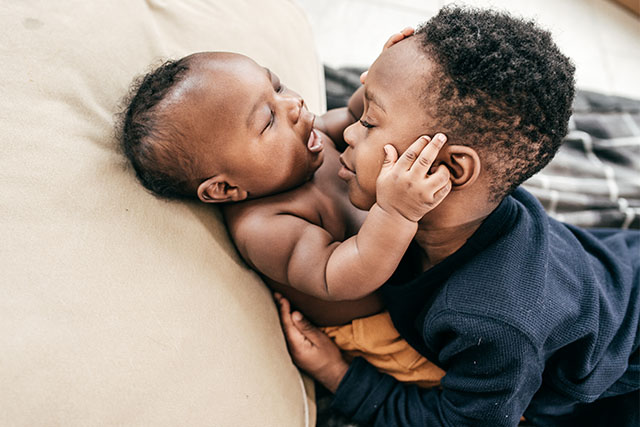 toddler with baby sibling