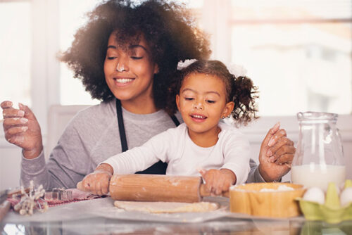 mom and toddler making cookies