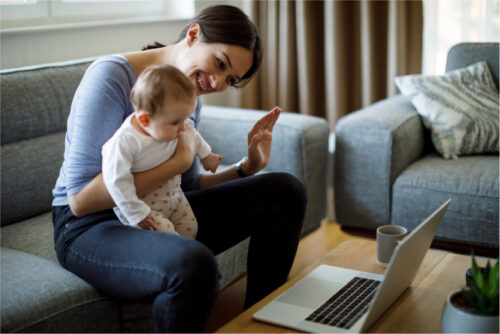 Mom and toddler video chatting with friends