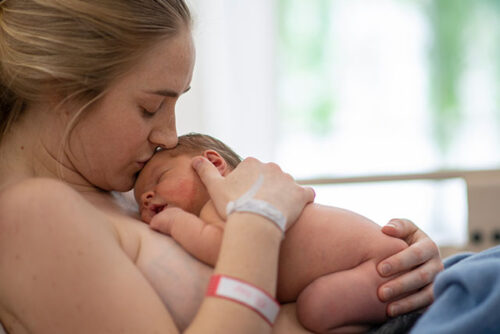 A woman with newborn.