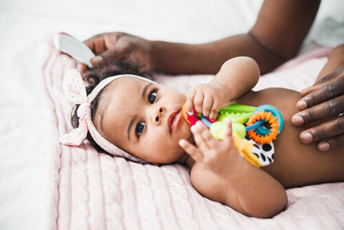 baby playing with toy