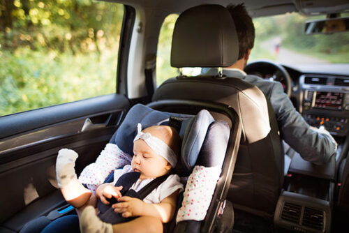 baby in car seat in car