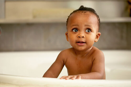 A baby in bath tub.