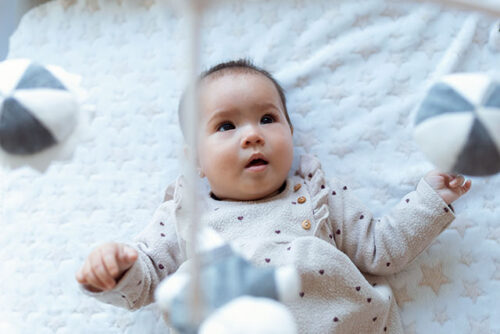 baby looking at mobile