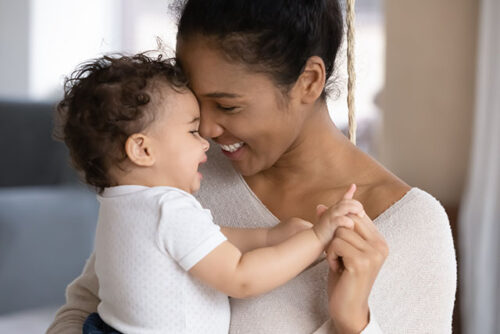 mom smiling with baby