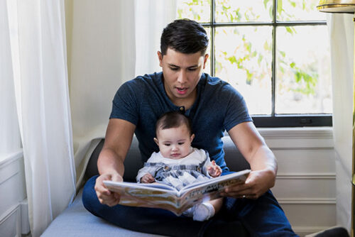 dad reading to baby