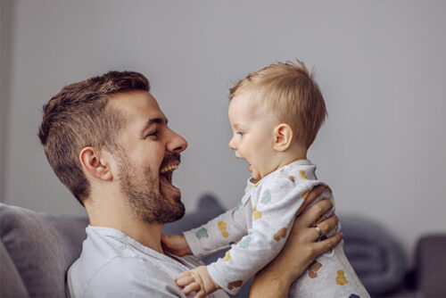 dad talking with baby