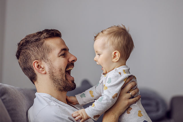 dad talking with baby