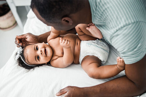 dad playing with baby