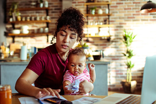Mom working with baby on her lap