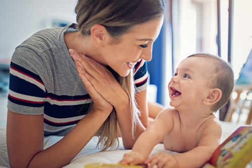 Mom laughing with baby