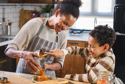 Mom and son baking together