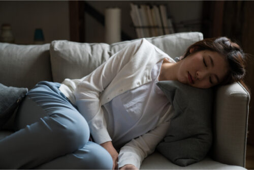 Woman napping on couch