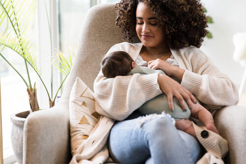 woman breastfeeding baby