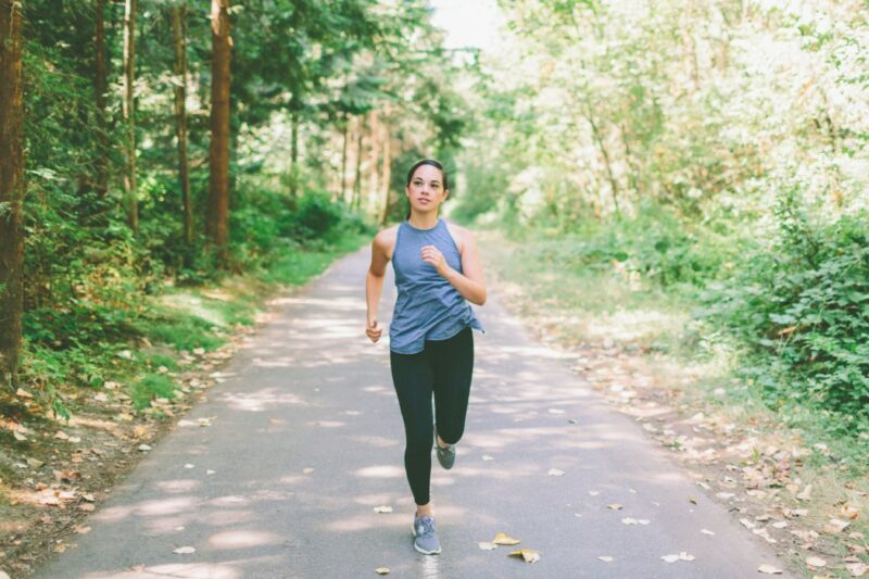 A person running because good physical health affects fertility.