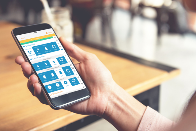 A person using the Ovia Fertility tracker on their cellphone device.