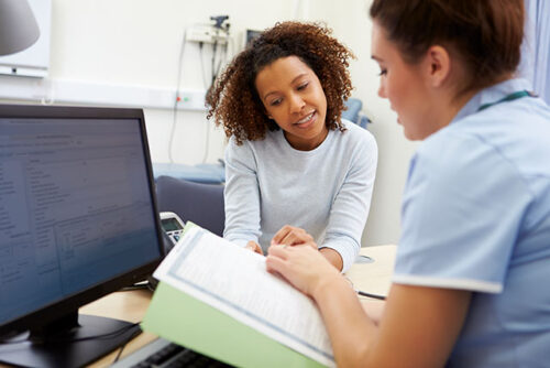 A person consulting with their healthcare provider.