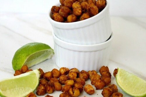 Chickpeas in a small container that can be a salad topping or eaten alone as a snack.