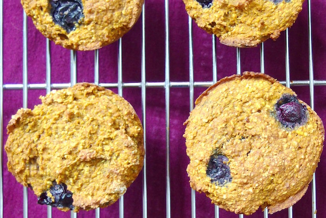 Pumpkin blueberry muffins in the oven.